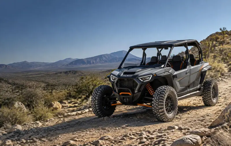 A four-seat side-by-side on a rocky desert trail, the vehicles these cases involve